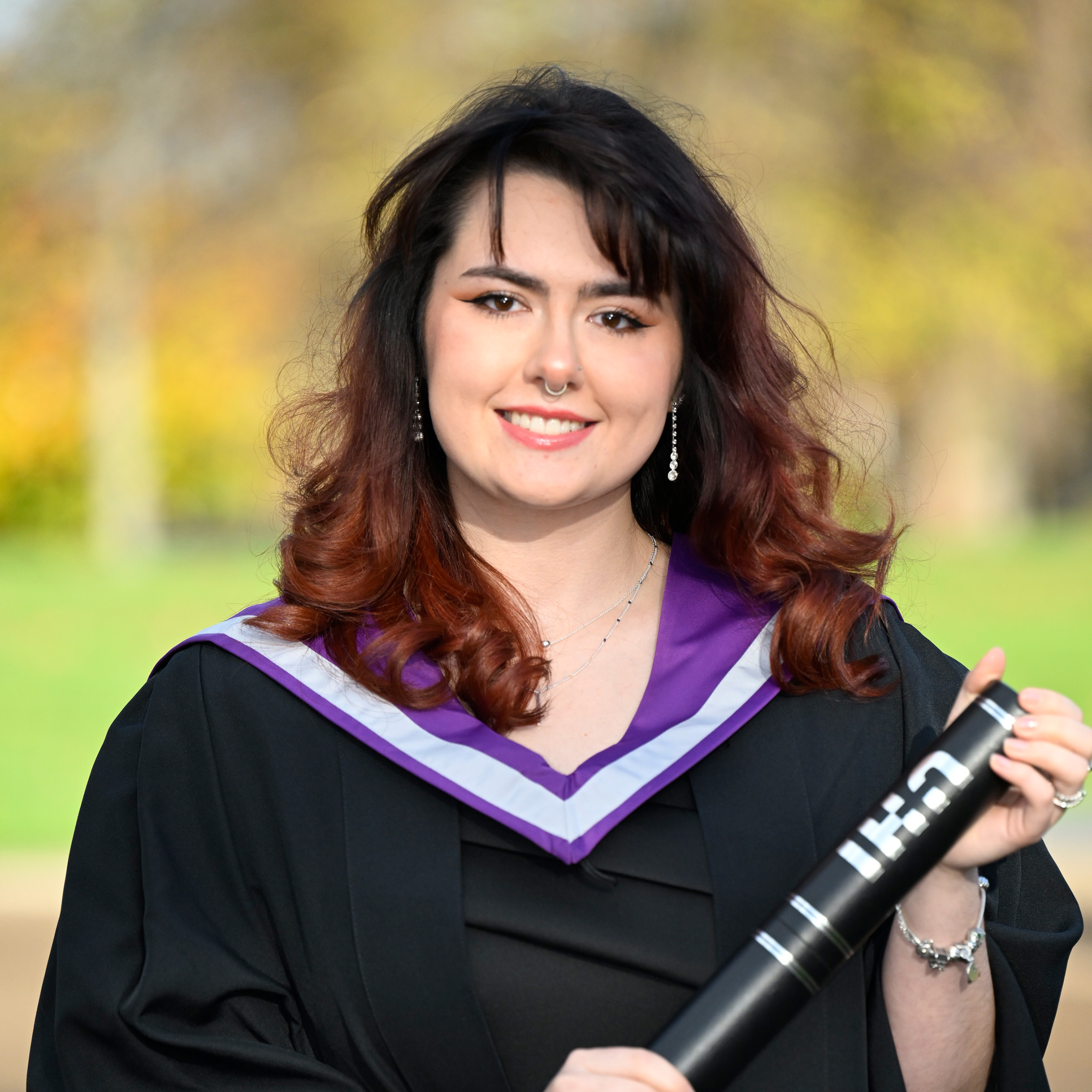 Zoe Nicoll holding a scroll