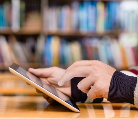 An individual using an iPad