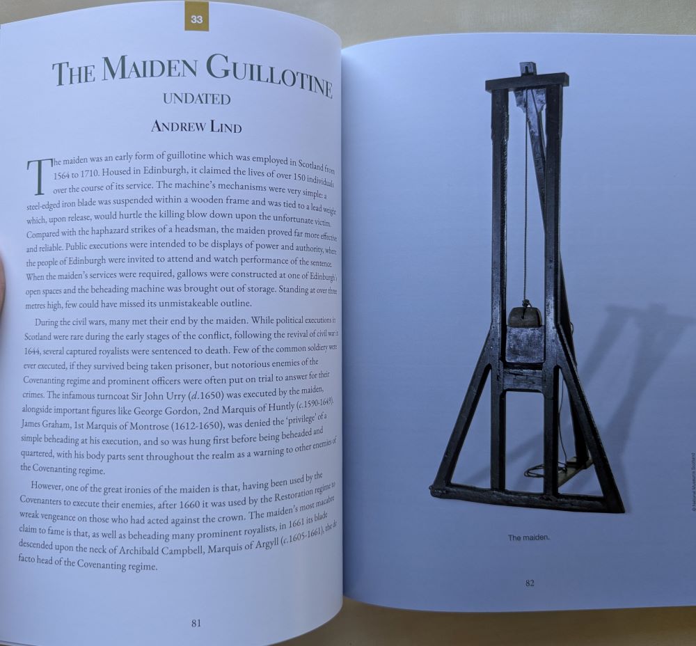 A photograph of the page of a book entitled the Maiden Guillotine